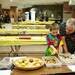 Austin, seven, and Rod Rodriguez browse the baked goods at Huron High School on Friday. Daniel Brenner I AnnArbor.com